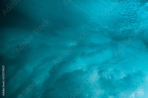 Ocean wave underwater. Blue texture