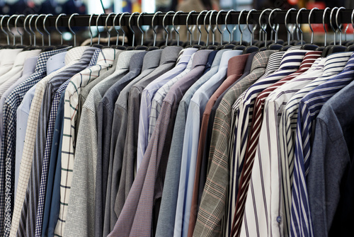 Men's shirts on hangers in the store, close-up