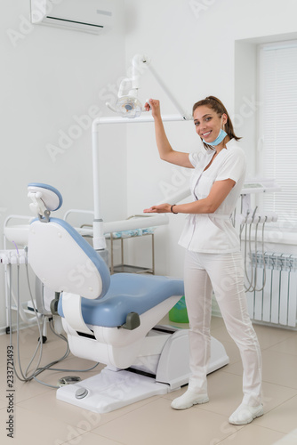 beautiful dentist girl meets her patient in the office