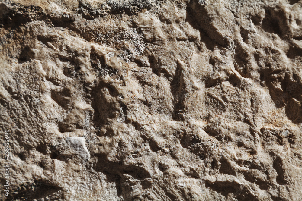 Rough stone texture with big details in harsh light