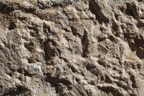 Rough stone texture with big details in harsh light