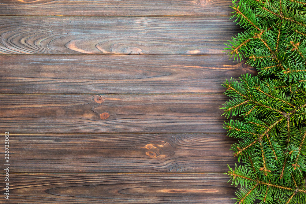 Christmas gray wooden background with fir tree and copy space. top view empty space for your design Christmas gray wooden background with fir tree and copy space. top view empty space for your design