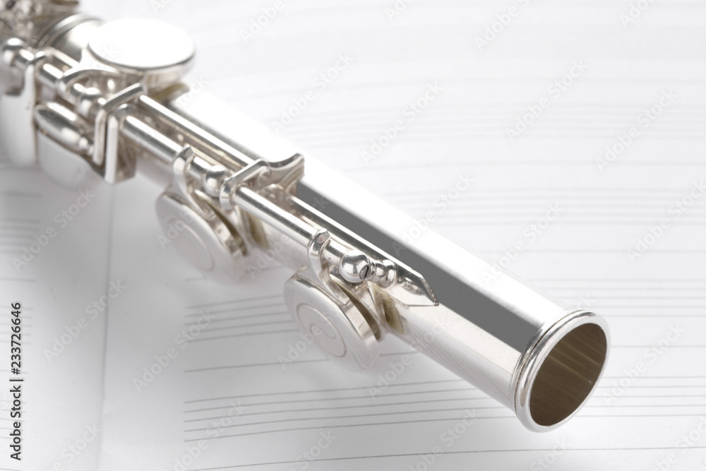 Fototapeta premium transverse flute rest on music score with copy space for your text