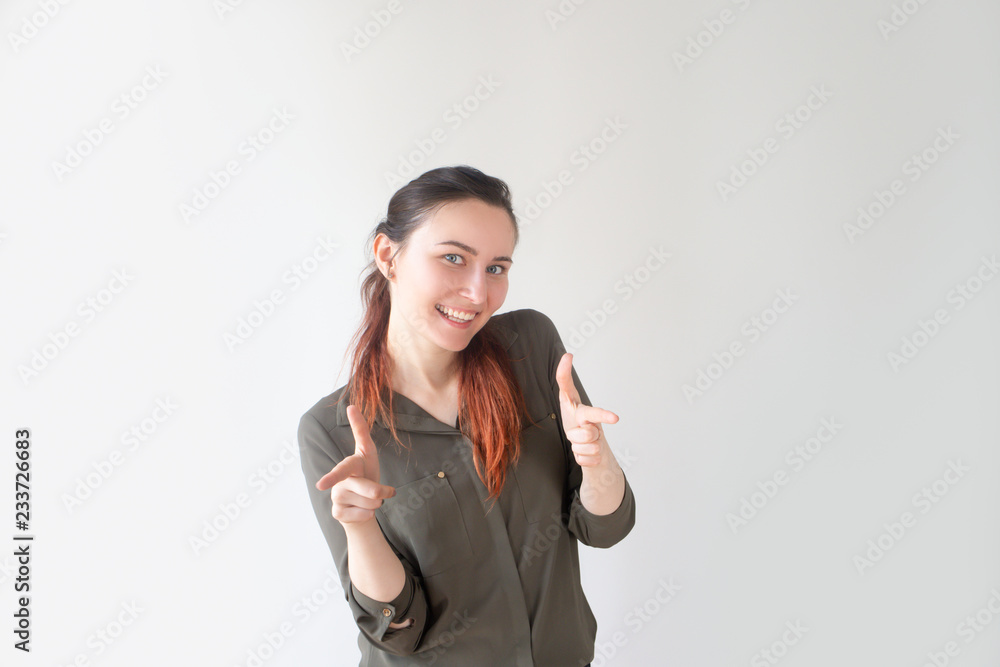 Smiling pretty Caucasian girl pointing at you with index fingers. Young female manager making choice. HR specialist concept Smiling pretty Caucasian girl pointing at you with index fingers. Young female manager making choice. HR specialist concept