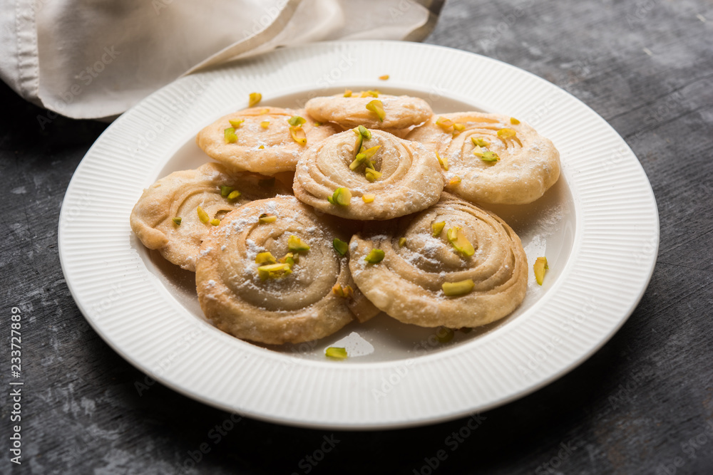 Chirote or Chiroti is a sweet dish from Karnataka and Maharashtra. Served in a plate as a dessert on Festivals or wedding. Selective focus Chirote or Chiroti is a sweet dish from Karnataka and Maharashtra. Served in a plate as a dessert on Festivals or wedding. Selective focus