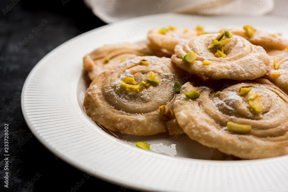 Chirote or Chiroti is a sweet dish from Karnataka and Maharashtra. Served in a plate as a dessert on Festivals or wedding. Selective focus Chirote or Chiroti is a sweet dish from Karnataka and Maharashtra. Served in a plate as a dessert on Festivals or wedding. Selective focus