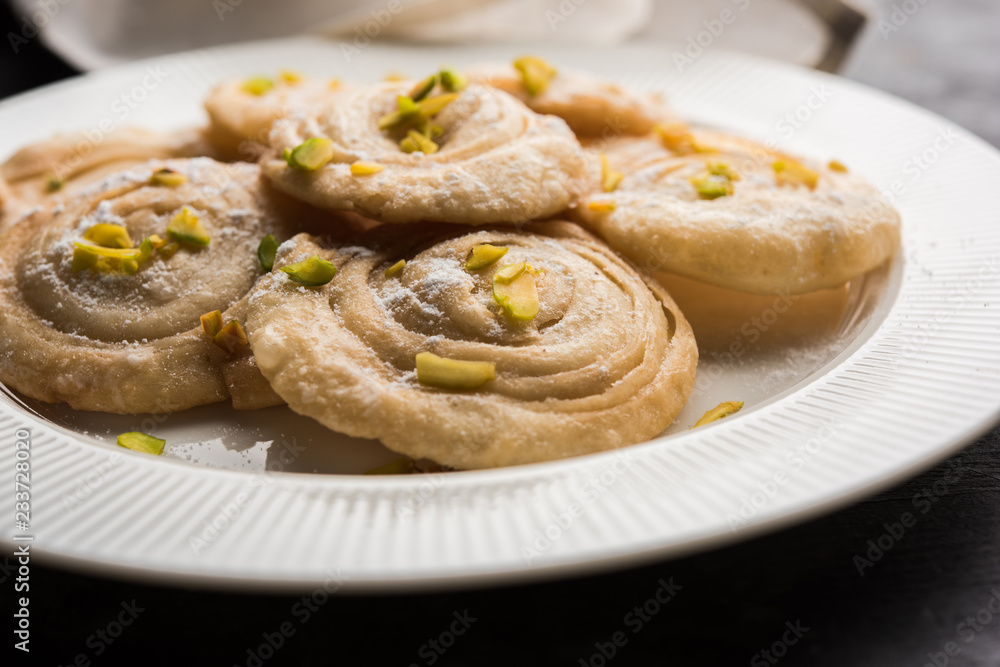 Chirote or Chiroti is a sweet dish from Karnataka and Maharashtra. Served in a plate as a dessert on Festivals or wedding. Selective focus Chirote or Chiroti is a sweet dish from Karnataka and Maharashtra. Served in a plate as a dessert on Festivals or wedding. Selective focus