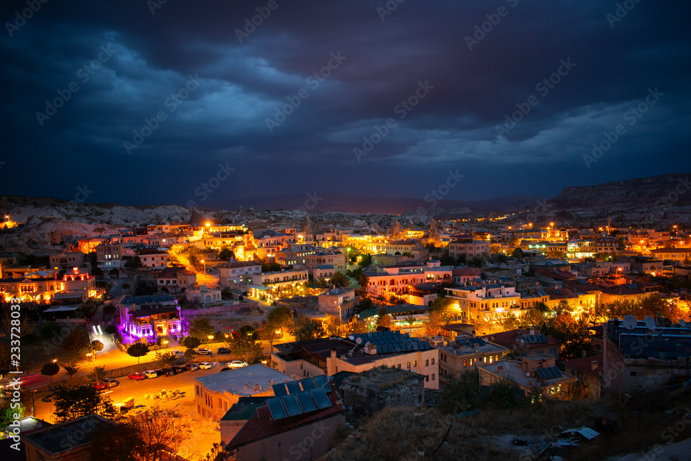 Fototapeta premium architecture and buildings in Cappadocia, Goreme, Turkey at night, aerial view . most popular and famous place