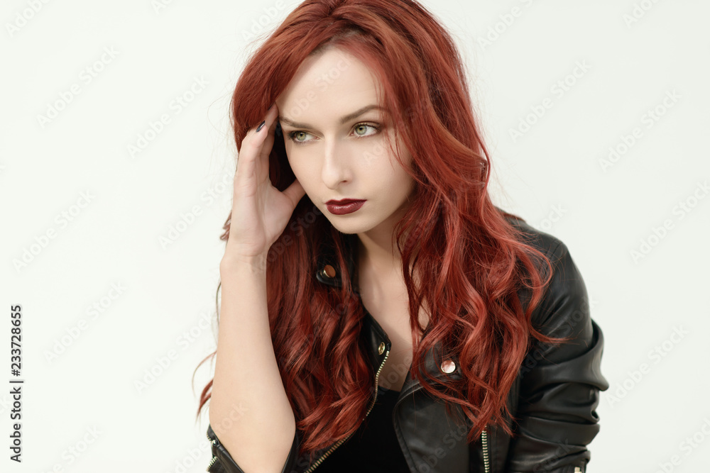 Portrait of attractive red haired young woman with blue eyes. Portrait of attractive red haired young woman with blue eyes.