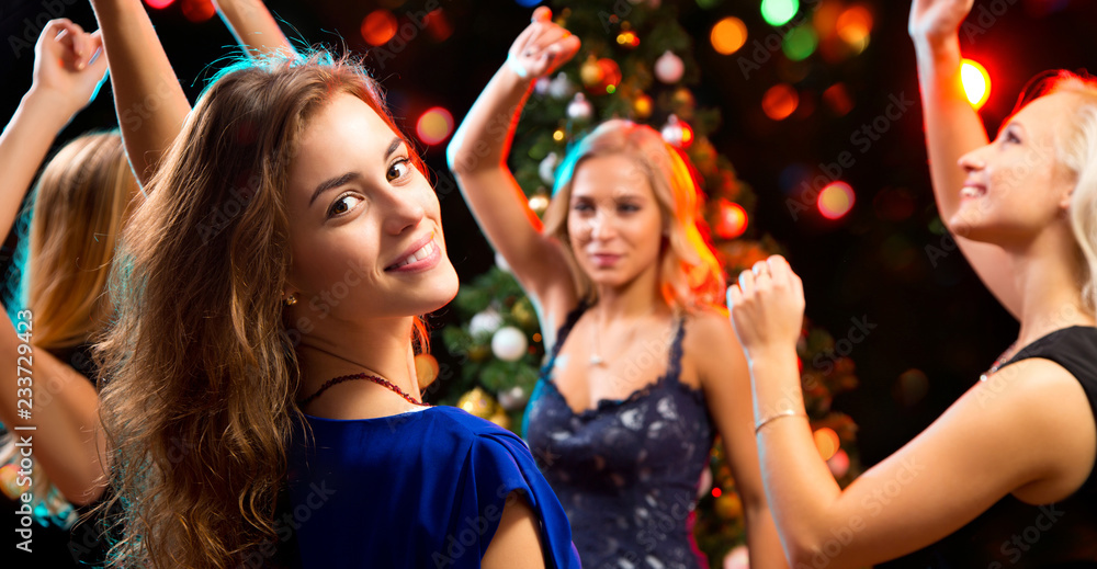 Beautiful girls have fun at a Christmas party