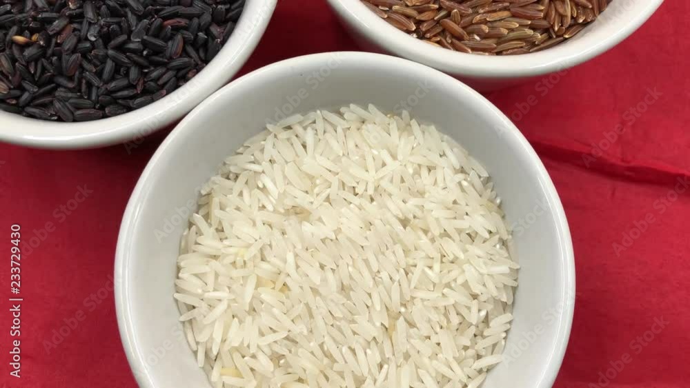 Three variety of rice: brown red whole, white Indian Basmati and black Italian Venere (Venus) Three variety of rice: brown red whole, white Indian Basmati and black Italian Venere (Venus)