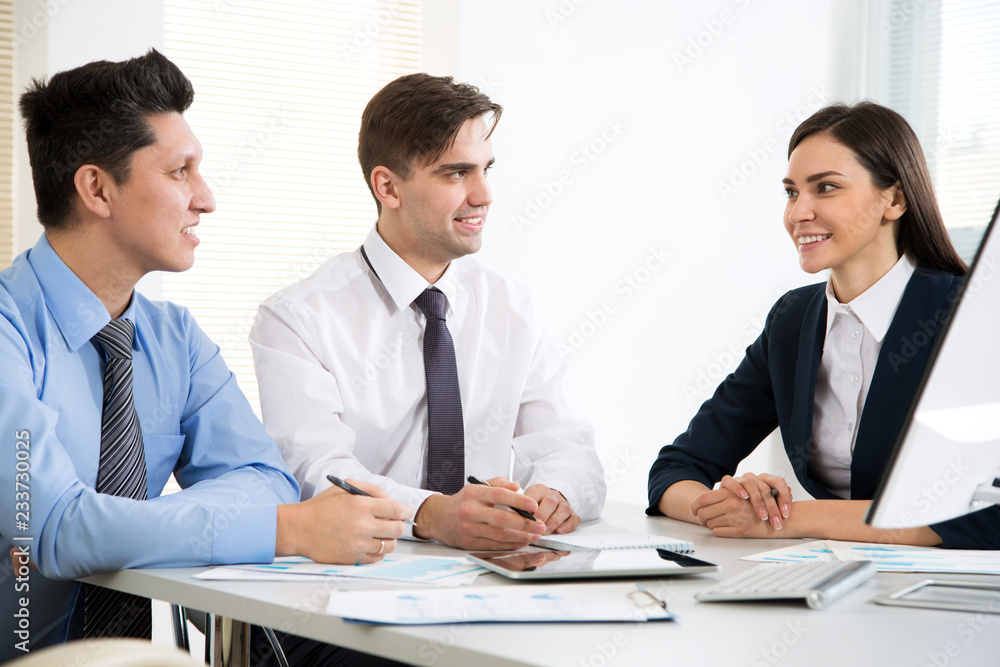 Businessman explains to colleagues a new project Businessman explains to colleagues a new project