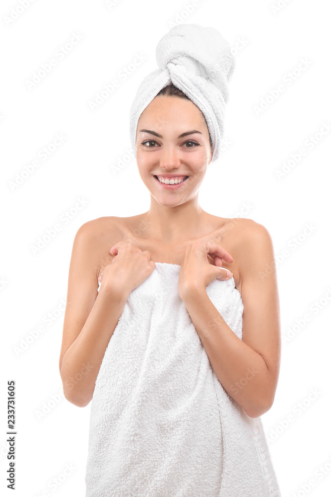 Beautiful young woman wrapped in towel on white background Beautiful young woman wrapped in towel on white background