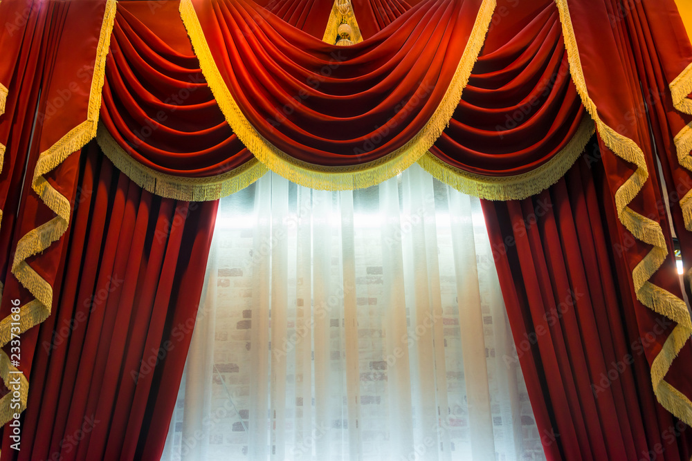 Beautiful luxury red curtains with gold trim tassel fragment interior  decoration for room Stock Photo | Adobe Stock
