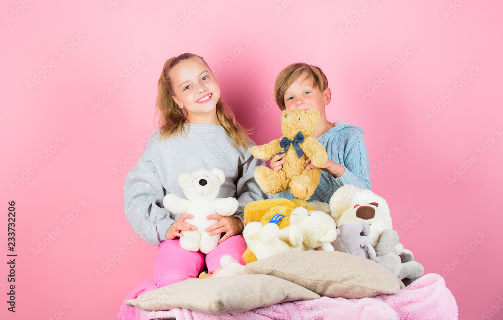 Teddy bears help children handle emotions and limit stress. Siblings playful hold teddy bear plush toys. Boy and girl play with soft toys teddy bear on pink background. Bears toys collection Teddy bears help children handle emotions and limit stress. Siblings playful hold teddy bear plush toys. Boy and girl play with soft toys teddy bear on pink background. Bears toys collection