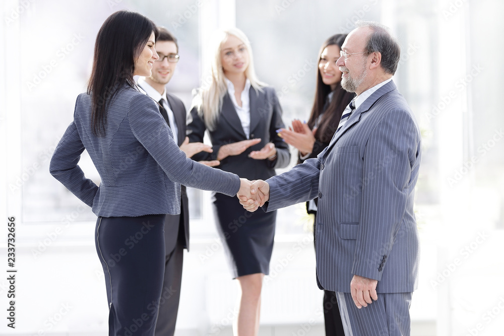 handshake of a businessman and business woman handshake of a businessman and business woman