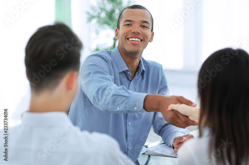 closeup.handshake Manager and the client in the office