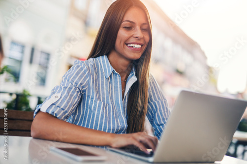 Girl typing on laptop