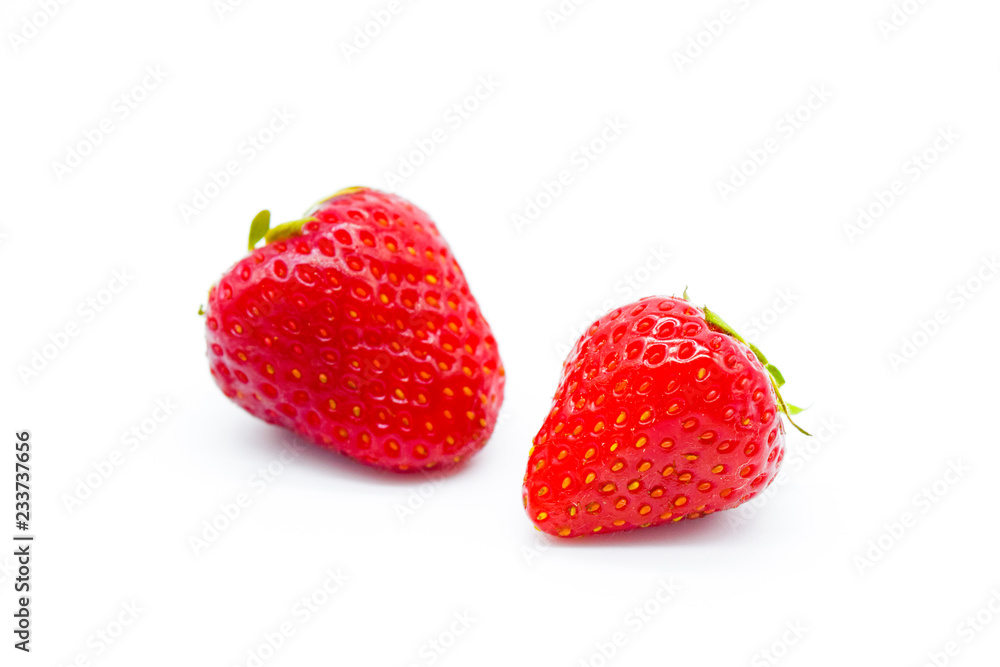 Two whole strawberries isolated on white background Two whole strawberries isolated on white background