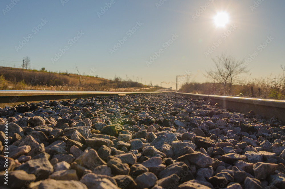 Obraz premium Railway leading to the mine territory with a stone balance.