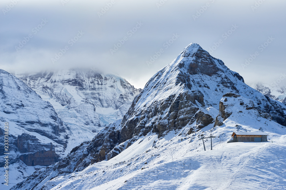 Winter mountain view of Tschuggen peak in Jungfrau region of Switzerland.