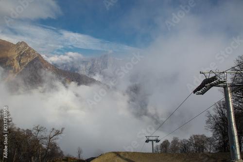 Ropeway or cable way to the foggy mountains