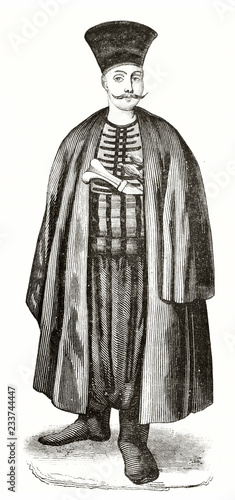 Engraved portrait of an ancient Armenian man in Constantinople with a long cloack and high hat. He also has long moustaches. By unidentified author published on Magasin Pittoresque Paris 1839 photo