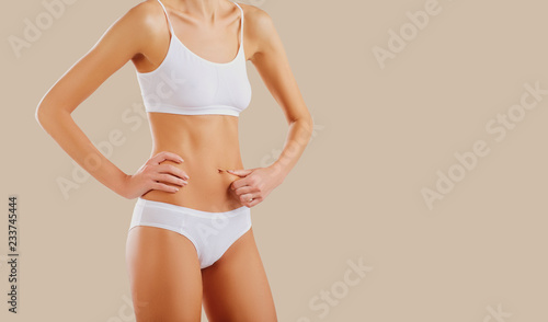 The body of a thin slim woman with a beautiful figure. 