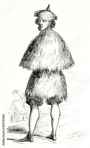 Old illustration of Ilocano man in his traditional straw costume standing barefooted, Philippines. By unidentified author published on Magasin Pittoresque Paris 1839