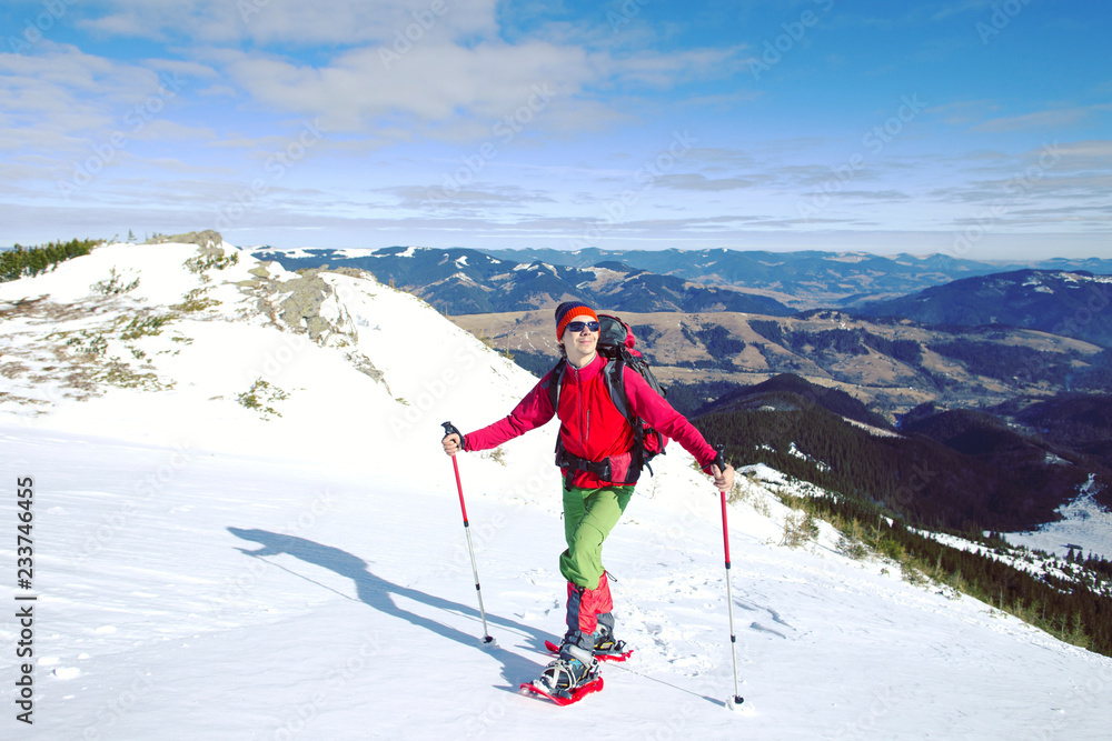 Winter hiking in the mountains with snowshoes. Winter hiking in the mountains with snowshoes.