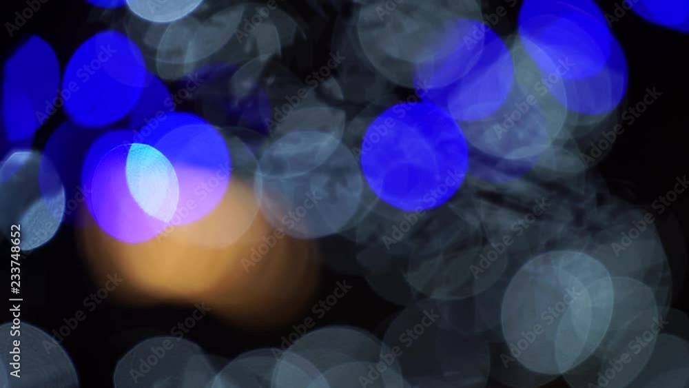 Urban night light blur bokeh defocused background. Blurr out of focus. Magical fairy festive Christmas backdrop. City scape at evening Urban night light blur bokeh defocused background. Blurr out of focus. Magical fairy festive Christmas backdrop. City scape at evening