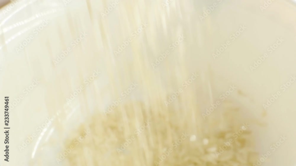 Rice poured into a plate. Close-up, HD Rice poured into a plate. Close-up, HD