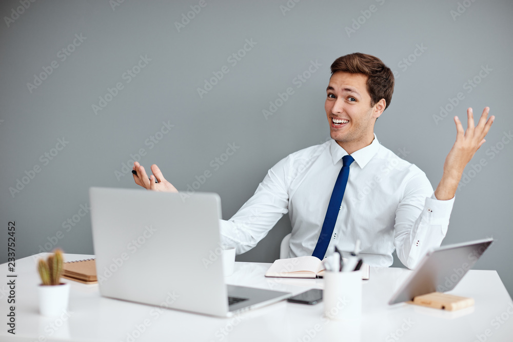 Young successful businessman on his work place Young successful businessman on his work place