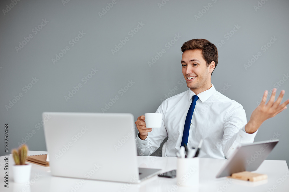 Young successful businessman on his work place Young successful businessman on his work place