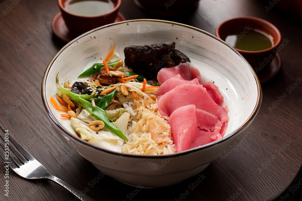 Asian food: rice with tuna and peanuts Asian food: rice with tuna and peanuts