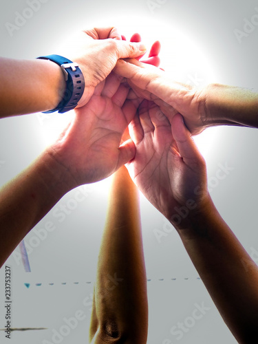 Close up young people putting their hands together/Team work business team showing unity with their hands together isolate on white background