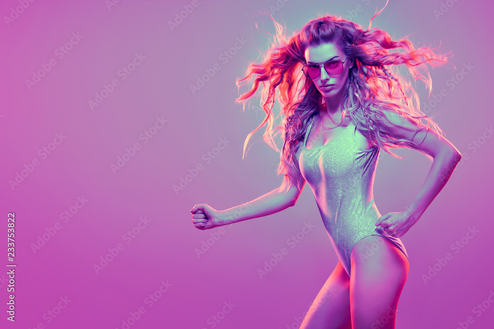 Warrior woman in Pink Blue neon light, Trendy Hairstyle. High Fashion. Sexy adorable long-haired Girl, Stylish Sunglasses. Design Art concept. Creative Colorful Bright Portrait Warrior woman in Pink Blue neon light, Trendy Hairstyle. High Fashion. Sexy adorable long-haired Girl, Stylish Sunglasses. Design Art concept. Creative Colorful Bright Portrait