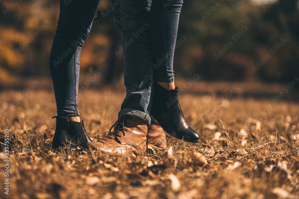 Young couple standing on the green grass Young couple standing on the green grass