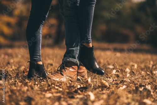 Young couple standing on the green grass