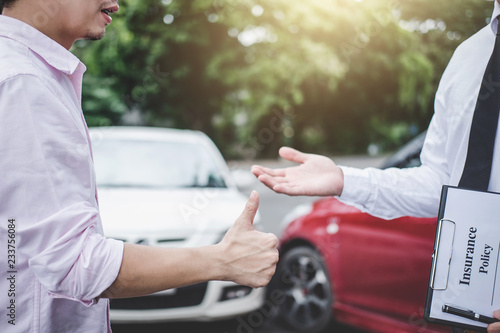 Konstfotografi Insurance Agent and customer shaking hands after claim contact, Traffic Accident