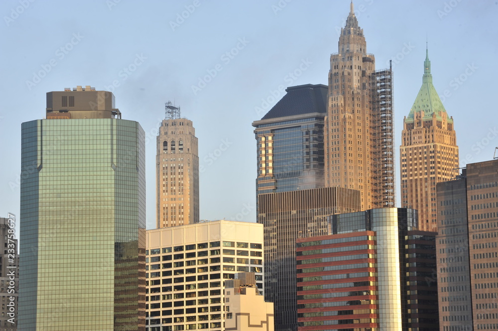 A group of buildings in Lower Manhattan as seen from Brooklyn Bridge in the morning