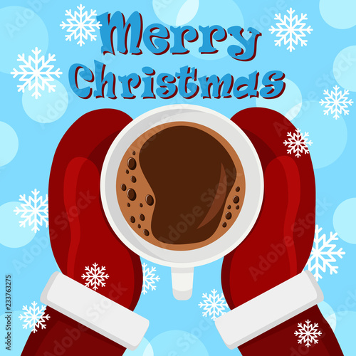 Santa is holding a Cup of coffee in his mittens. The view from the top.