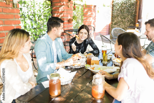 Friends Enjoying Social Gathering Time At Burger Shop