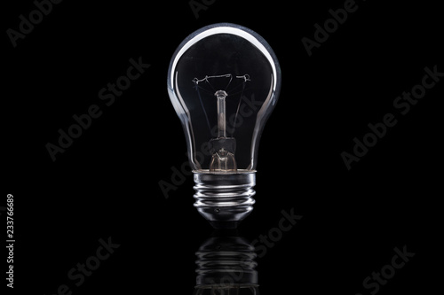 Light bulb on black background photo