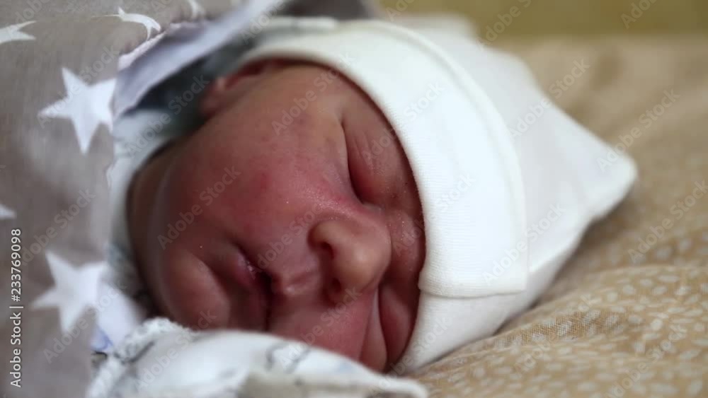 Newborn baby sleeps. Little 4 days old newborn boy lies in cot in maternity hospital. Asleep newborn baby boy Newborn baby sleeps. Little 4 days old newborn boy lies in cot in maternity hospital. Asleep newborn baby boy