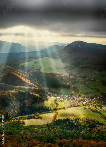 Vertical panorama of the landscape. HDR and HD background effect on the phone. Hills and forests during autumn with sunset and sunbeams.