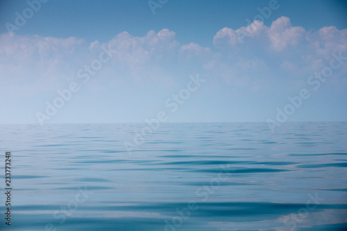 Beautiful sky and blue smooth ocean.
