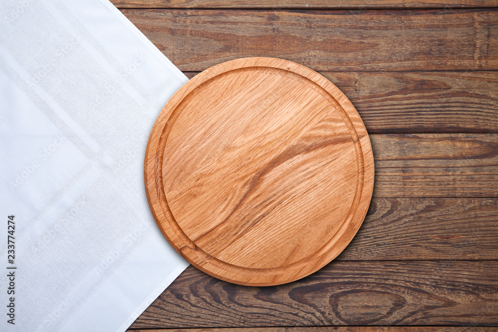 Table cloth and pizza board on vintage wooden table. Top view mock up