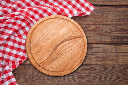 Table cloth and pizza board on vintage wooden table. Top view mockup