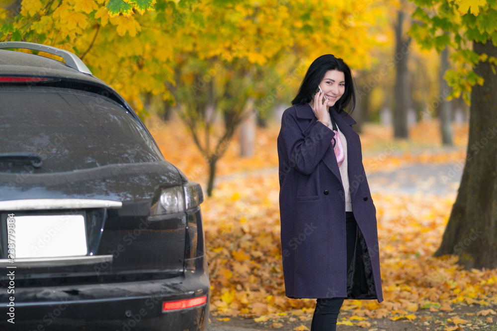 Young woman chatting on her mobile phone Young woman chatting on her mobile phone